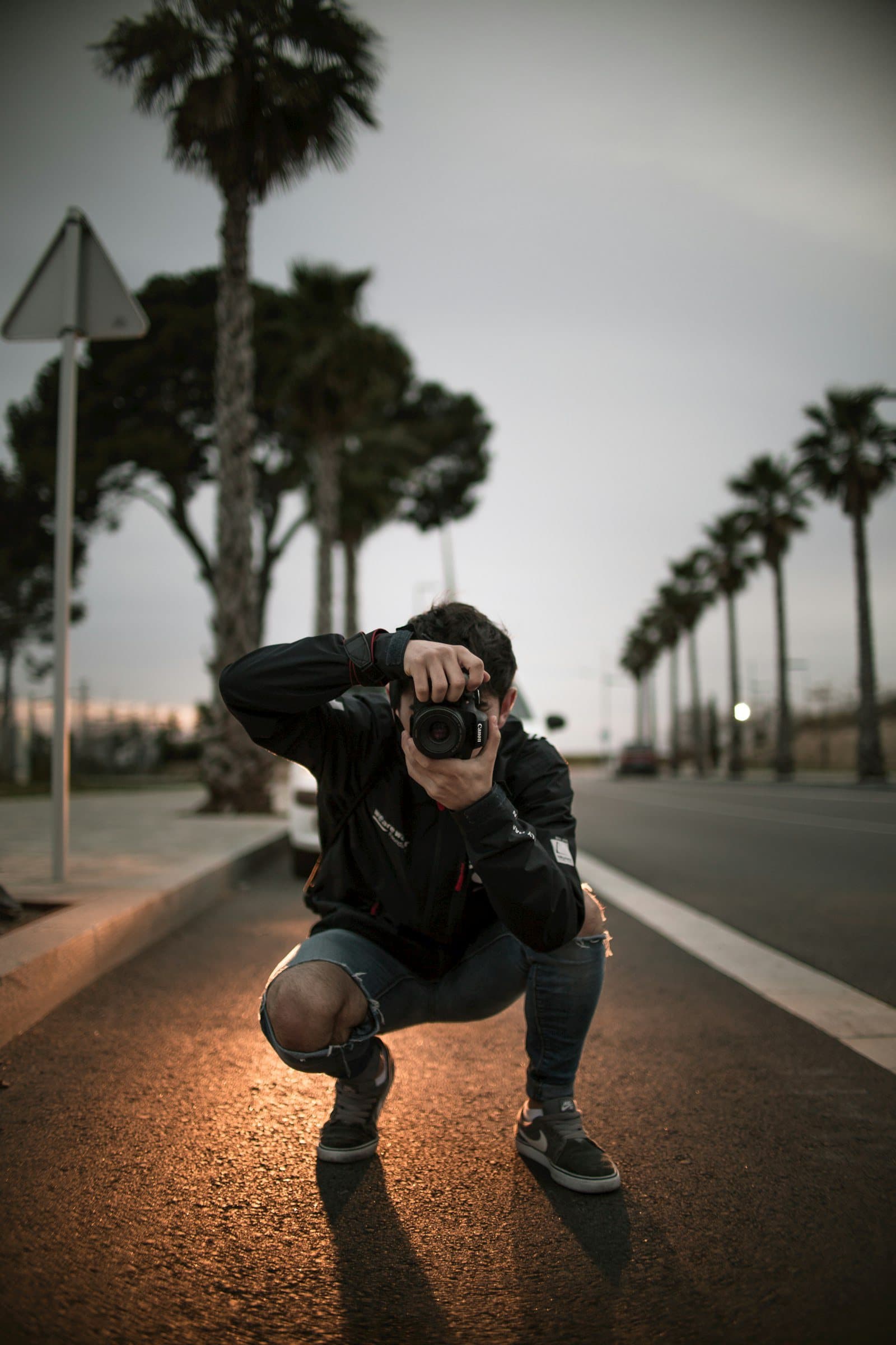 Omar Saleh photographing on location at sunset